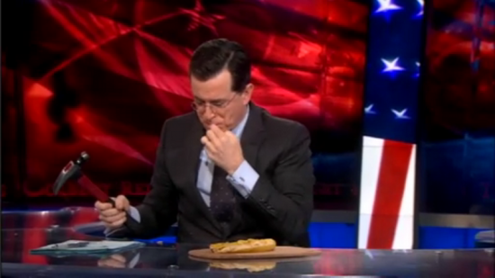 Stephen Colbert pickes up pieces of smashed banana