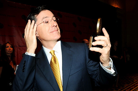 Stephen Colbert admires his Peabody