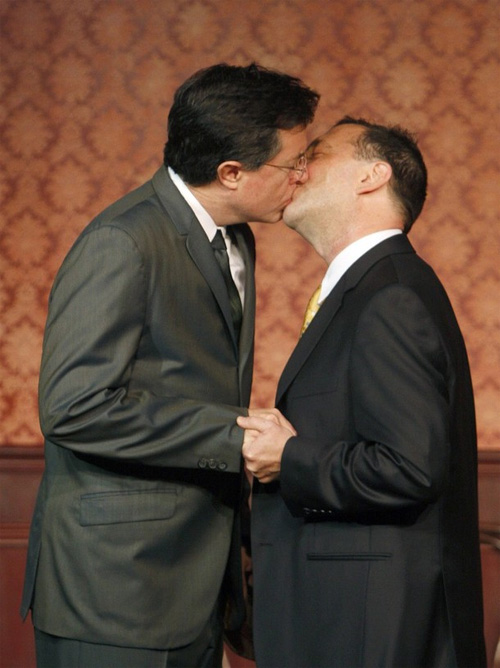 Fanfic blitzkrieg in 3 ... 2 ... 1 ... Stephen Colbert (L) kisses Dave Razowsky as they perform in a skit as part of the 50th anniversary of improv theater, The Second City, in Chicago December 12, 2009.