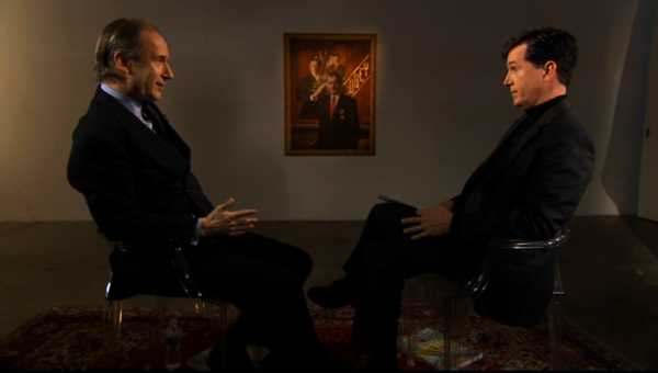 Take a look at my portrait. Okay, Phil? What's going on down there? Stephen Colbert and Simon de Pury