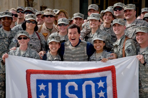 Stephen Colbert poses with the troops in Iraq